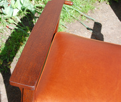 Detail chair arm & quality leather upholstery.